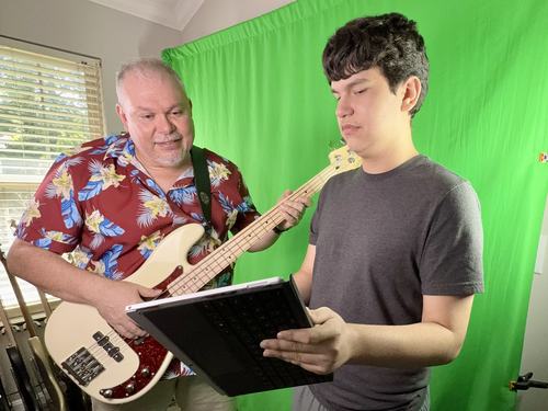 Father and son working behind the scenes